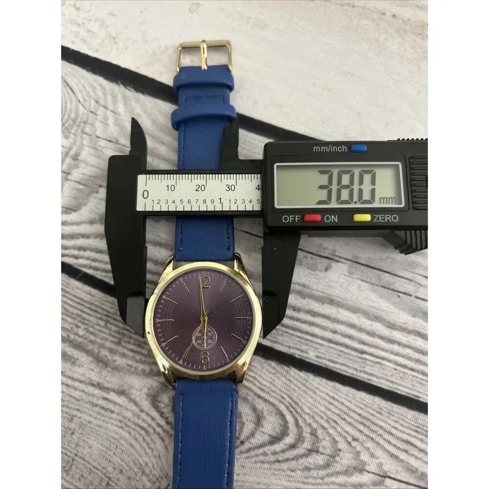 Gold Tone Case Purple Dial Blue Band Women’s Quartz Watch